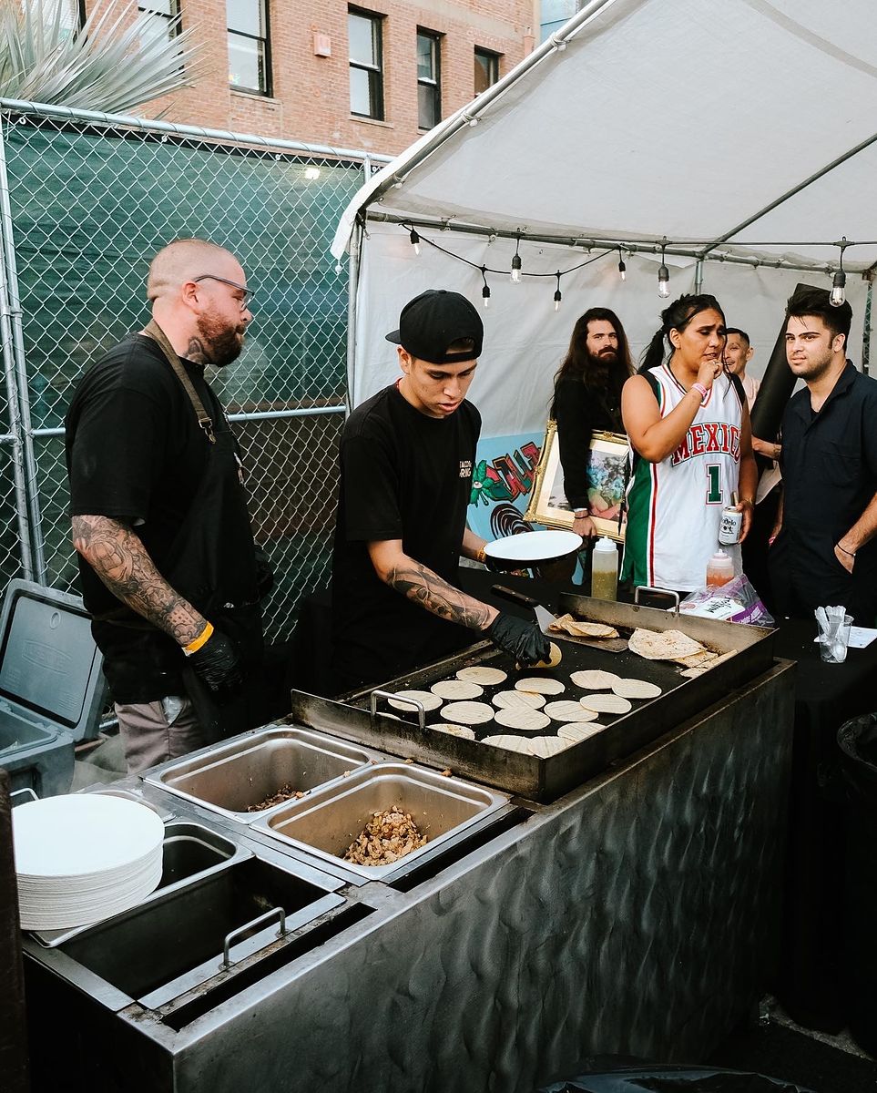 Tacos El Gringo crew cooking at a catered event